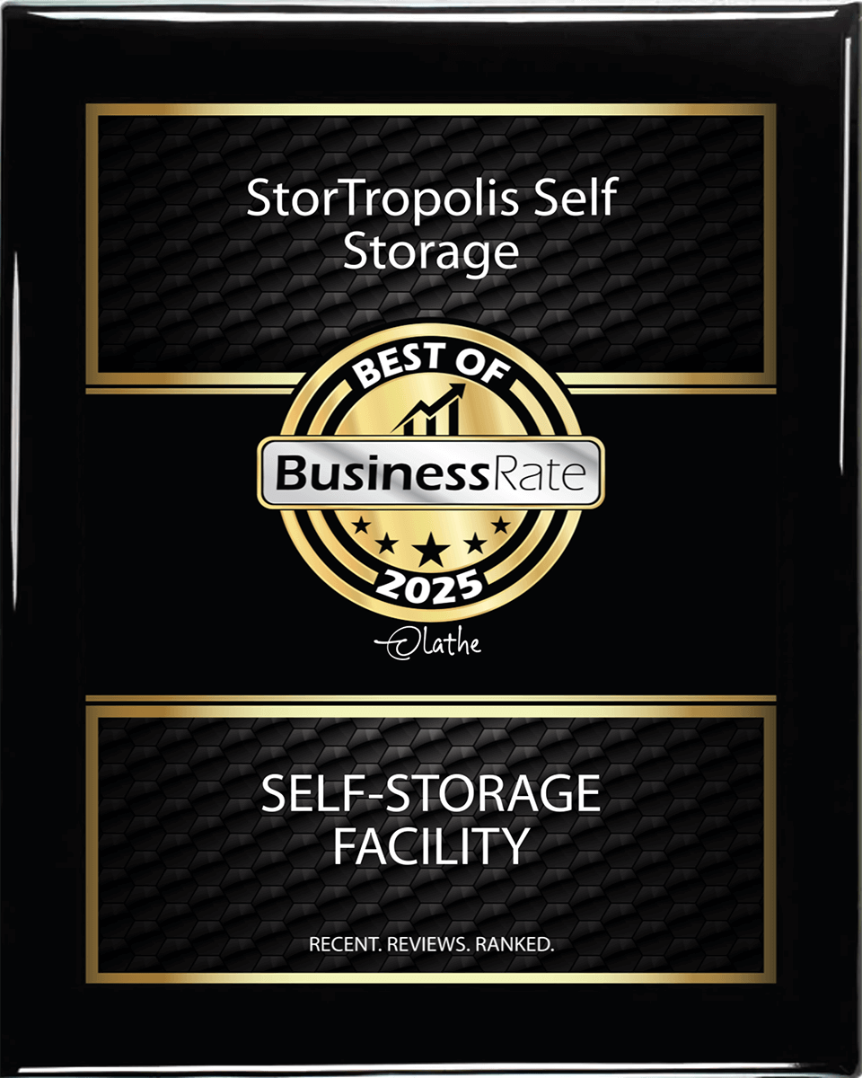 Black and gold plaque recognizing StorTropolis as 'Best Self-Storage Facility 2025'.